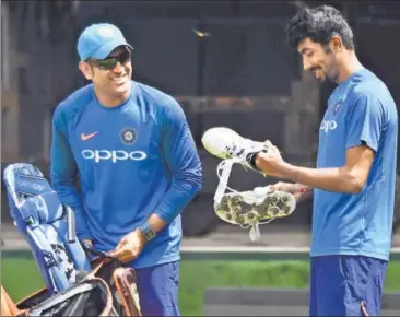  ?? AFP ?? MS Dhoni and Jasprit Bumrah during a training session ahead of the third ODI at the Holkar stadium on Saturday. India have a formidable record in Indore, winning all the four games they have played here.