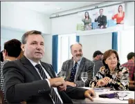  ?? AP/PETER SCHNEIDER ?? Werner Salzmann (front, left), Swiss parlamenta­rian of conservati­ve party SVP and a member of the committee against the European Union gun laws and policies, speaks at the committee’s meeting Sunday in Burgdorf, Switzerlan­d.