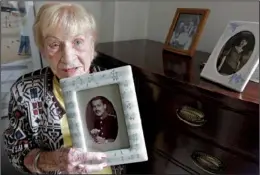  ?? AP/M. SPENCER GREEN ?? Holocaust survivor Edith Stern, 92, holds a picture of her father. She lost her mother, father and husband in the camps.