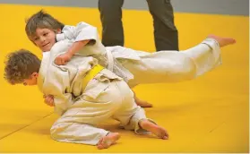  ??  ?? Rece Schindel and Connor Casson compete in the Ne Waza event at the Swift Current Judo Club home tournament on Feb. 18.