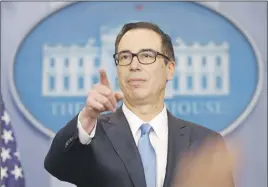  ?? Ap pHoTo ?? Treasury Secretary Steve Mnuchin points to a member of the media as he answers questions during the daily briefing in the Brady Press Briefing Room of the White House in Washington, Monday.