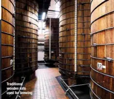  ??  ?? TRADITIONA­L WOODEN VATS USED FOR BREWING