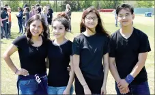  ?? Photo by Mike Eckels ?? Ithzel Martinez (from left), Ashley Herrera, Dora Hernandez and Joseph Chang pose at Bulldog Stadium for the “Revolution 2021” day assembly at Decatur Middle School on April 12. A conversati­on between these four friends sparked a revolution to change...