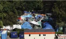  ?? CHAD HIPOLITO/THE CANADIAN PRESS ?? A B.C. Supreme Court judge ordered those living in Victoria’s tent city to leave by today due to worsening sanitary conditions.