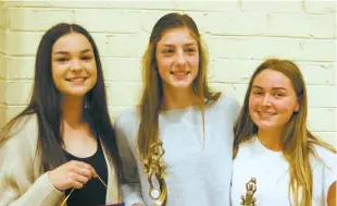  ??  ?? E grade award winners from left Abbey Commadeur of Dusties (goal throw), best and fairest Ella Spencer and runner up best and fairest Holly Andrews