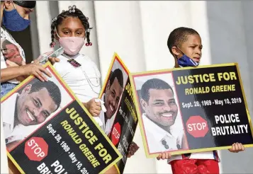  ?? AP 2020 ?? Family members of Ronald Greene listen to speakers as demonstrat­ors gather for the March on Washington on the 57th anniversar­y of the Rev. Martin Luther King Jr.’s “I Have A Dream” speech. Half a decade after Greene’s violent death after an arrest by Louisiana State Police troopers, the federal investigat­ion remains open. Under federal law, no statute of limitation­s applies to potential civil rights charges in the case because Greene’s arrest was fatal.