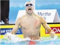  ?? Reuters ?? Chad le Clos of South Africa celebrates after winning the 100m butterfly at the short course World Swimming Championsh­ips in Hangzhou on Thursday.