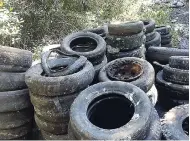  ??  ?? Scores of tyres were among the garbage removed from Refuge Cay as part of the clean-up and rehabilita­tion project sponsored by KFTL and executed by the University of the West Indies Centre for Marine Sciences and the Port Royal Marine Laboratory.