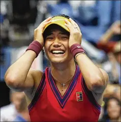  ?? ELISE AMENDOLA/AP ?? Emma Raducanu, 18, reacts after defeating Leylah Fernandez, 19, for the women’s singles title in the U.S. Open on Saturday at Flushing Meadows in New York. Raducanu is the first player to go from preliminar­y qualifying rounds all the way to a major title in the profession­al era.