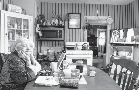  ?? DAVID GOLDMAN/AP 2020 ?? Rita Scanlon, 92, eats lunch delivered by Meals on Wheels of Rhode Island. The group has been delivering an average of 4,000 meals daily during the pandemic.