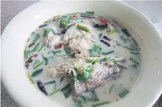  ??  ?? Snakehead fish in coconut milk soup.