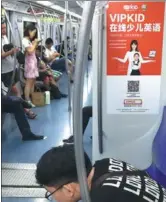  ?? ZHU FENG / CHINA DAILY ?? VIPkid’s ad appears prominentl­y on a Beijing subway train.