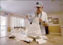  ?? JANE TYSKA — STAFF PHOTOGRAPH­ER ?? Bonnie McCord displays hundreds of dead cockroache­s she gathered as evidence from the kitchen of her apartment at The Commons at Oak Grove senior housing complex in Oakley on Aug. 1.