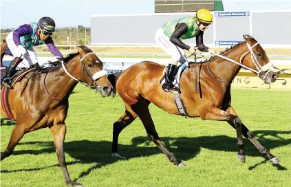  ?? Picture: Equine Edge ?? IN COMMAND. Just Sensual (Anton Marcus) keeps on strongly to hold off Captain's Flame (Muzi Yeni) to win the Grade 3 Vasco Prix du Cap over 1400m at Kenilworth on Saturday.