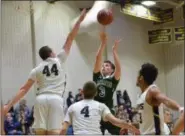  ?? THOMAS NASH - DIGITAL FIRST MEDIA ?? Methacton’s Brett Eberly (3) puts up a shot while SpringFord’s Robert Bobeck (44) rises up to defend.