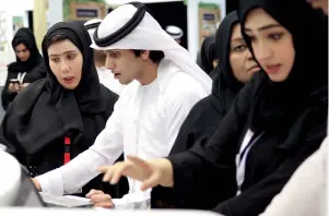  ??  ?? Volunteers help jobseekers who thronged the pavilions on the first day of UAE Careers 2018.