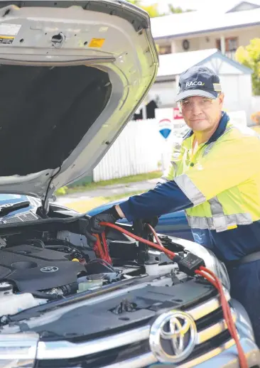  ?? Picture: JACK LAWRIE ?? ON THE JOB: RACQ roadside assistance provider Gary Ansell is kept busy.