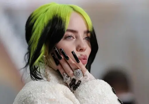  ?? John Locher/Associated Press ?? • 3/4/21
Singer Billie Eilish arrives at the Oscars in Los Angeles in February 2020.