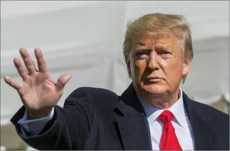  ?? MANUEL BALCE CENETA — THE ASSOCIATED PRESS ?? President Donald Trump waves after speaking to reporters upon arrival at the White House Sunday in Washington.