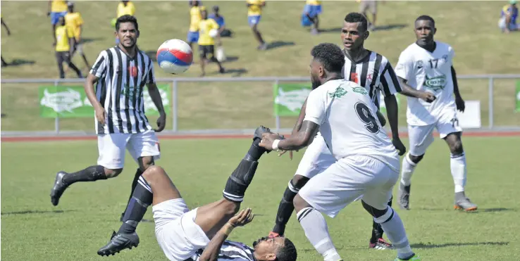  ?? Photo: Waisea Nasokia ?? Dreketi’s Sisa Valesua defends against Suva’s Savenaca Nakalevu at the Churchill Park in Lautoka on July 21, 2018.