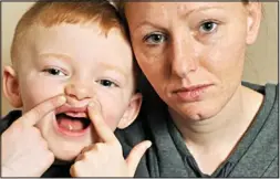  ??  ?? Hard to smile: Cameron with his mother Wendy Jackson