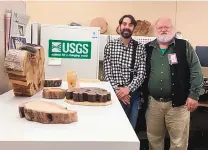  ?? COURTESY PHOTO ?? Tree-ring researcher­s Ellis Margolis, left, and Tom Swetnam show off some of the fruits of their labor at the U.S. Geological Survey lab in Santa Fe.