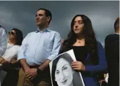  ?? JOANNA DEMARCO/GETTY ?? Members of the public stand at a vigil for journalist Daphne Caruana Galizia on Sunday at the spot where she was killed in Bidnija, Malta.