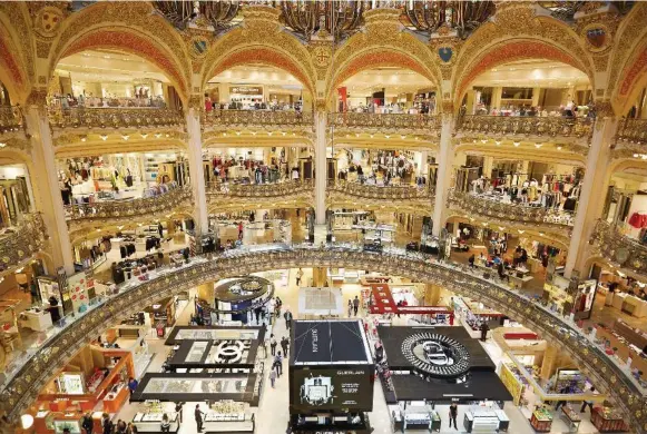  ?? DREAMSTIME ?? Be enthralled by Galeries Lafayette, a 10-storey art nouveau palace of consumer chic on Boulevard Haussmann that stages a free fashion show every Friday.