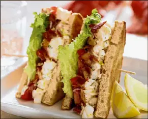  ?? MICHAEL TERCHA / CHICAGO TRIBUNE ?? To make a BLT even better, add lobster. This variation by Betty Rosbottom from her book “Soup Nights” dresses lobster chunks in a lemon zest and tarragon mayonnaise.