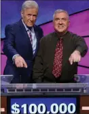  ?? PROVIDED BY ‘JEOPARDY!’/FILE ?? New Paltz resident Francois Barcomb, right, is shown on the ‘Jeopardy!’ set with host Alex Trebek after winning the game show’s $100,000 Teachers Tournament, which aired in May 2019.