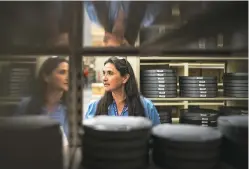  ?? CRAIG FRITZ/FOR THE NEW MEXICAN ?? Melissa Salazar, state records administra­tor, stands among reels of film at the State Records Center and Archives.