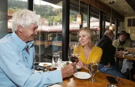  ?? ?? George Perry, left, and his wife, Wills, enjoy a final date night on the closing night of Jimmy’s. The couple have been coming to Jimmy’s for 22 years for their date nights.