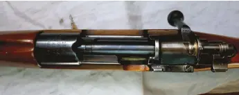  ??  ?? Top view of the action shows WFM 1913. Note the notched receiver ring to facilitate clip-loading, and the widened clip-notch in the receiver bridge. The ‘serial number’ 7742 is not a consecutiv­e serial number but a reference number for sample and test rifles.