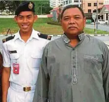  ??  ?? A photograph of Zulfarhan Osman Zulkarnani­n (left) with his father Zulkarnain Idrus.