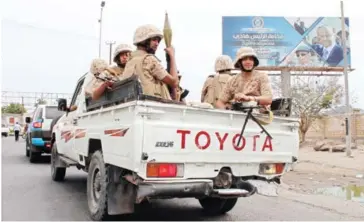  ?? SALEH AL-OBEIDI/AFP ?? Fighters from Yemen’s southern separatist movement sit in a truck in the country’s second city of Aden on Sunday during clashes with forces loyal to the Saudi-backed president.