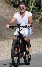  ??  ?? Easy rider...Simon on electric bike