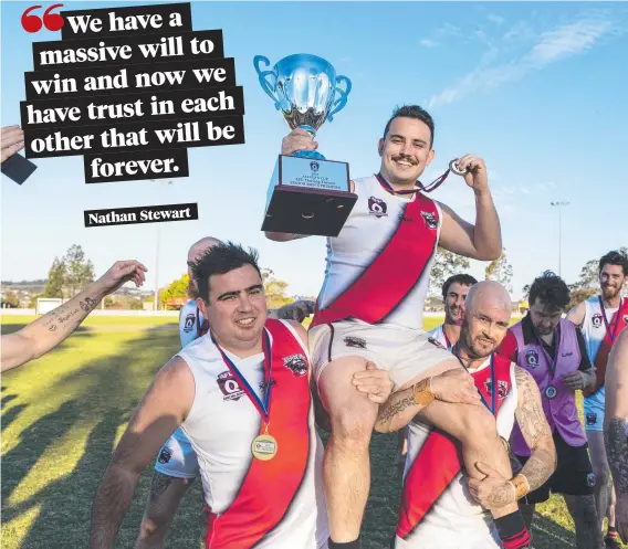  ?? Pictures: Kevin Farmer ?? Dylan Newman lifts the Allieds Cup while being carried by brothers Ben (left) and Craig Newman at Rockville Oval.