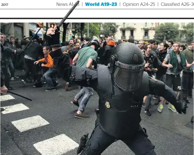  ?? Picture / AP ?? Images of brute force to stop people voting in Catalonia, Spain, went around the world.