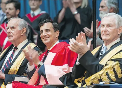 ?? JOHNS HOPKINS UNIVERSITY ?? Ronald J. Daniels, centre, appears at a University of Toronto commenceme­nt ceremony. Daniels was a law student, professor and finally a dean at U of T before becoming the first Canadian president of Johns Hopkins.