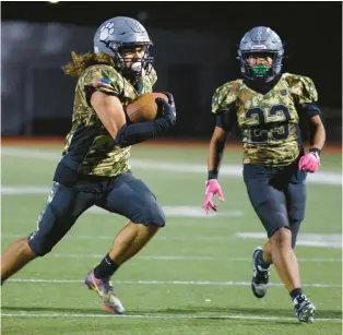  ?? JANE THERESE/SPECIAL TO THE MORNING CALL ?? Dieruff’s Jonathan Serrano runs for a touchdown against Pocono Mountain East in an EPC football game Saturday in Allentown. The National Guard sponsored the event and provided military vehicles and special uniforms for Dieruff.