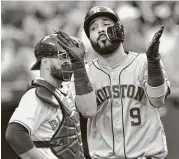  ?? Frank Gunn / Canadian Press ?? Marwin Gonzalez, right, experience­d highs and lows in the Astros’ loss Thursday night, from celebratin­g a home run to getting ejected from the game.