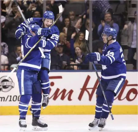  ?? RICHARD LAUTENS/TORONTO STAR ?? It took until the second period for the Leafs to get a little jump — William Nylander leaping into Morgan Rielly’s arms after the latter’s goal — and as soon as they took a lead on Nylander’s goal in the third, they gave it right back.