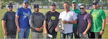  ?? Photo by Matthew Liebenberg ?? The Riverside Electric team won the 2018 NHL Playoff Black Tie Hockey Draft. They received a cheque of $7,500 and the Crescent Point Energy cup during a pre-game ceremony at the Swift Current 57's game against Melville, June 15.