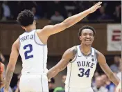  ?? Gerry Broome / AP ?? Duke’s Gary Trent Jr. (left) and Wendell Carter Jr. and the Blue Devils will face the Clemson Tigers on Sunday.