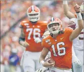  ?? RICHARD SHIRO — THE ASSOCIATED PRESS ?? Clemson quarterbac­k Trevor Lawrence reacts after scoring a touchdown Oct. 12, 2019, against Florida State in Clemson, S.C.