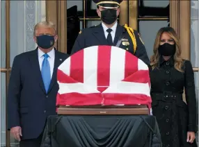  ?? J. SCOTT APPLEWHITE — THE ASSOCIATED PRESS ?? President Donald Trump and first lady Melania Trump pay respects as Justice Ruth Bader Ginsburg lies in repose at the Supreme Court building Thursday.