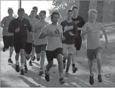  ?? Graham Thomas/Siloam Sunday ?? Members of the Siloam Springs boys cross country team start off down the bike trails on the campus of John Brown University during practice on Wednesday morning.