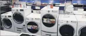  ?? Ted Shaffrey / Associated Press ?? Check local stores for the appliance you are considerin­g buying online so you can touch and feel the materials and see if it will fit with your home.