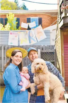  ?? COURTESY OF SIERRA FOGAL ?? Sierra Fogal, with Zara in her arms, joins husband, Reed Confer, and their dog, Ziggy, for a photo on Zara’s first day home from the hospital.