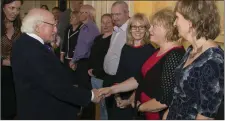  ?? Margaret Scully from Killarney meets President Higgins. ??